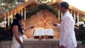 Wayfarers Chapel couple lighting candle at altar