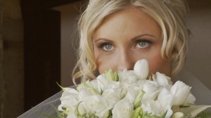 photo of bride looking over her bouquet