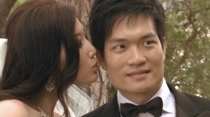Bride kissing groom during their wedding, scene from video
